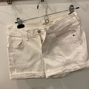 Classic boyfriend white shorts with little rip in them. Great for summer